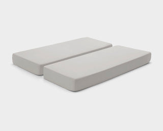 Adjustable bed fitted sheets by It-Fits in neutral Beige, displayed on a split mattress with deep pockets against a simple backdrop.