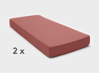 It-Fits premium knitted cotton jersey fitted sheets in vintage rose, perfectly fitted on a split king mattress with deep pockets against a plain background.