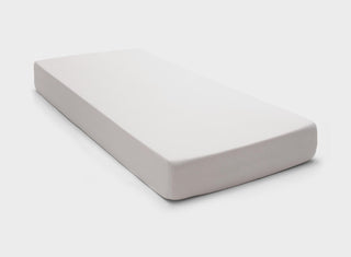 It-Fits fitted sheet in beige colour, demonstrating a perfect fit with deep pockets on a single mattress against a plain background.