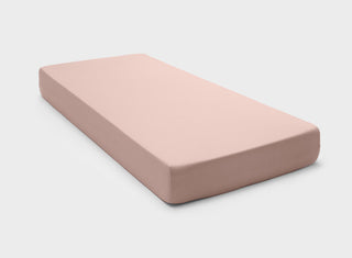 It-Fits 100% Australian cotton jersey fitted sheet in dusty pink, fitting a single mattress with a 360-degree elastic hem and deep pockets.