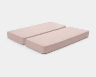 Stretchy, easy-care fitted sheets in Dusty Pink by It-Fits, shown on a split king mattress with deep pockets against a plain background.