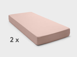 Stretchy, easy-care fitted sheets in Dusty Pink by It-Fits, shown on a split king mattress with deep pockets against a plain background.
