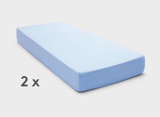 It-Fits fitted sheets for adjustable beds in Sky Blue, shown on a dual king mattress with deep pockets against a plain background.