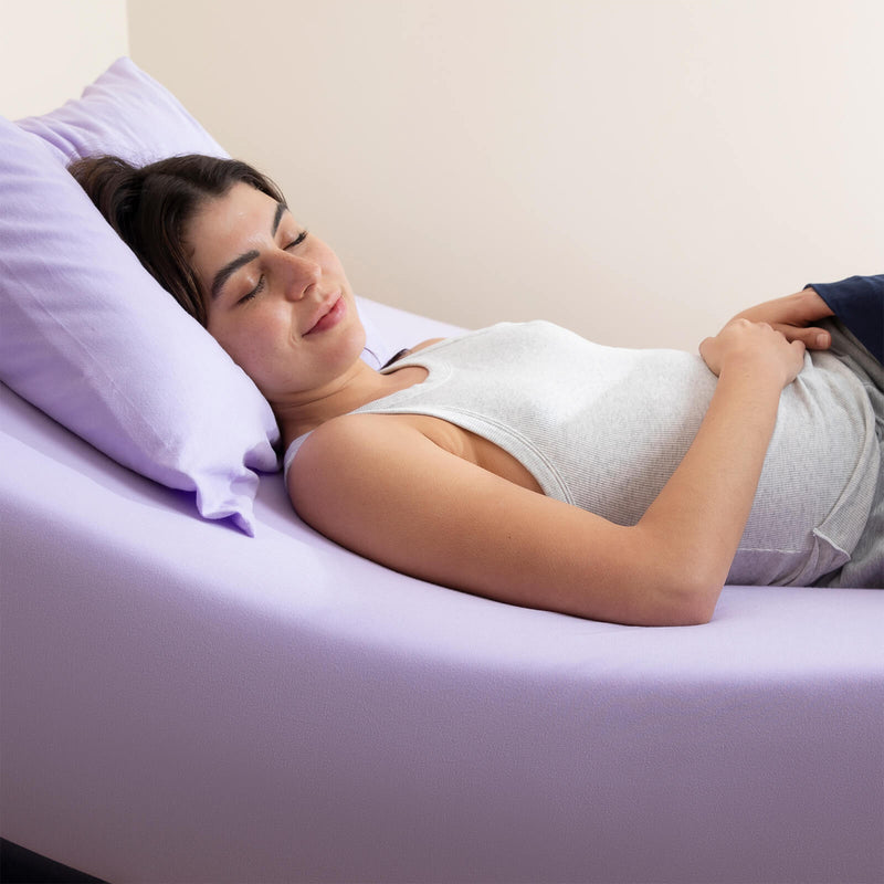 Purple stretch jersey fitted sheet on an adjustable bed designed for comfort and flexibility