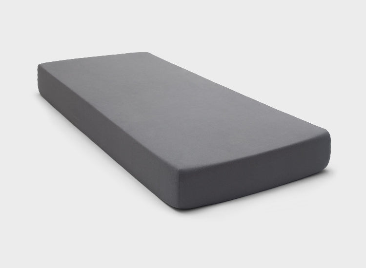 It-Fits fitted sheet in charcoal grey colour, snugly covering an Australian single-sized mattress with deep pockets, against a plain background.