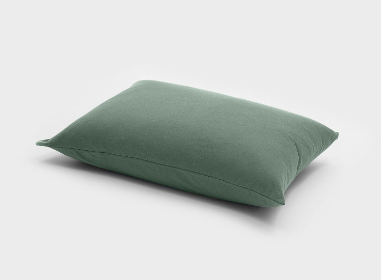 Crafted from smooth 100% Australian cotton, this sage green pillow slip by It-Fits is displayed on a pillow, one pack.