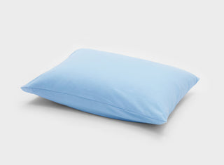 Designed for comfort, this sky blue pillowcase by It-Fits is made from breathable cotton jersey and shown on a pillow, one pack.